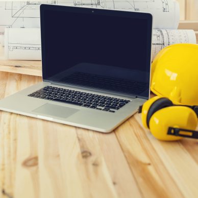 Contemporary laptop on placework for construction worker
